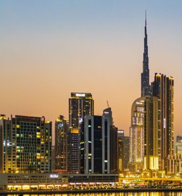 View of Dubai skyline including the Burj Khalifa, the world's tallest skyscraper as seen from Business Bay Marina in downtown Dubai